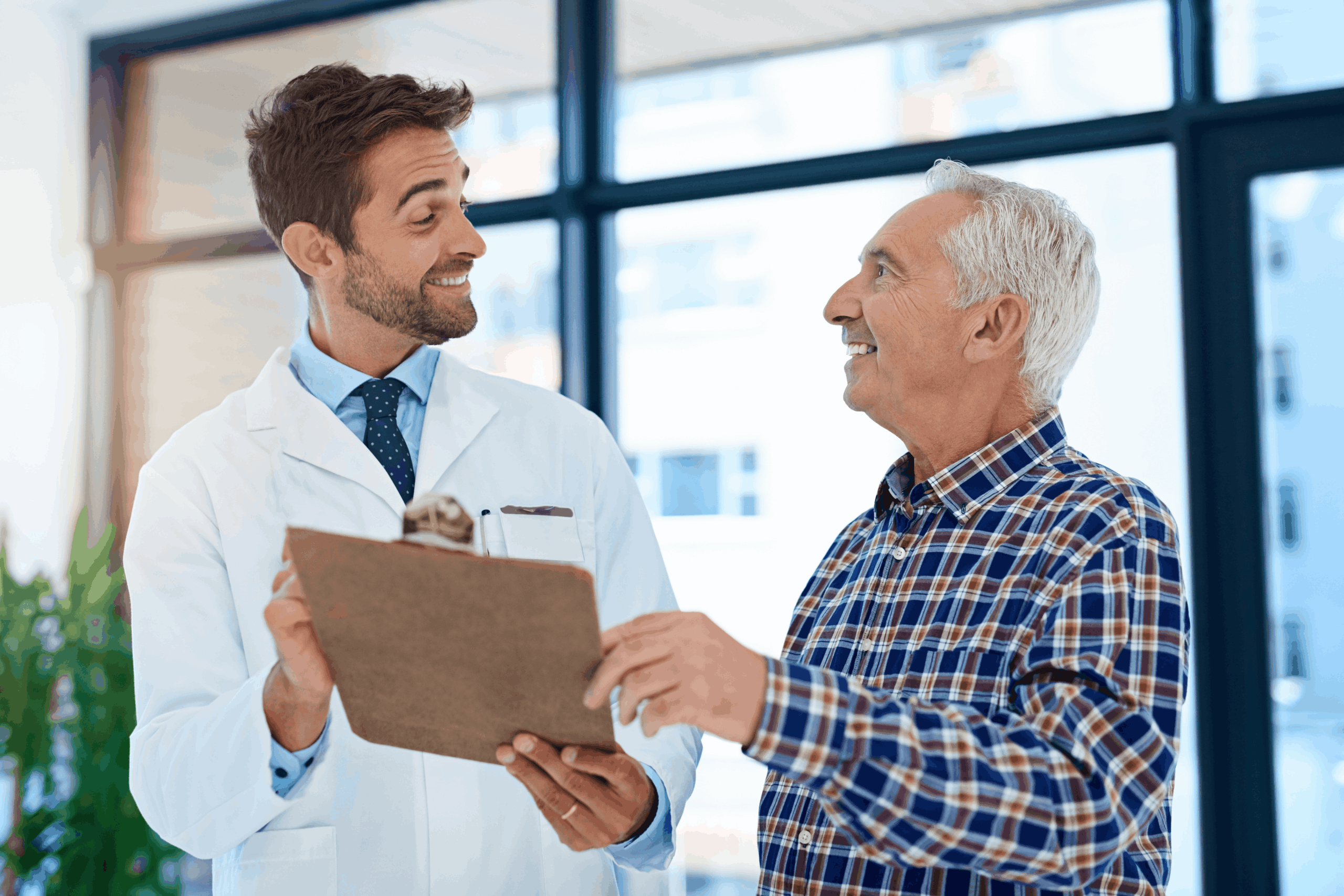 Doctor consulting with senior patient